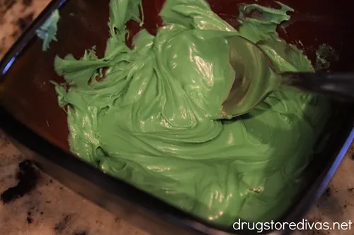 Melted green chocolate in a bowl.