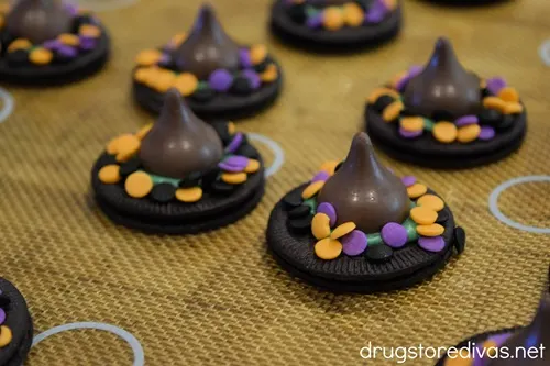 A bunch of Oreo cookies decorated to look like witches hat.