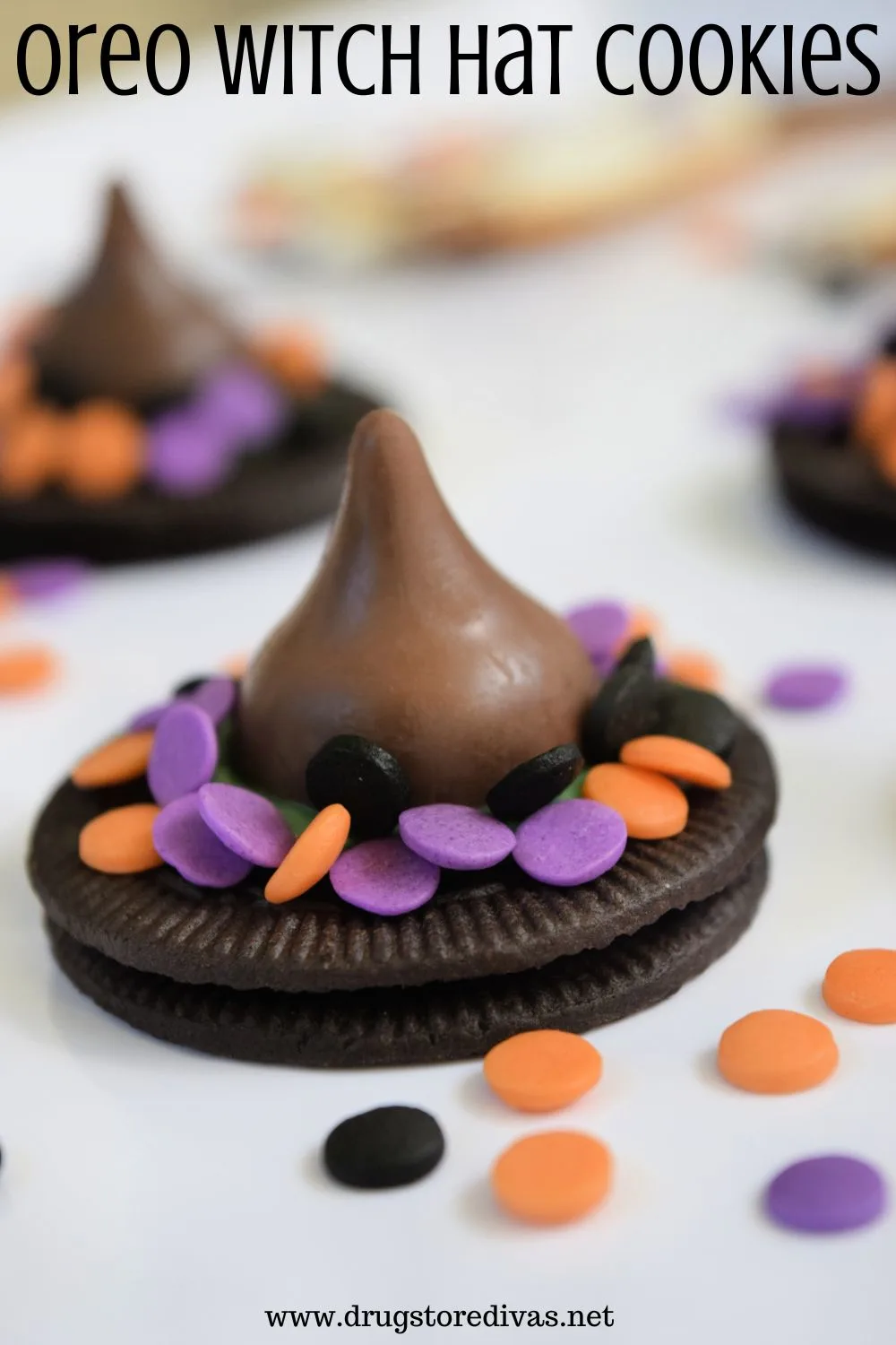Oreo Thins cookies decorated to look like witch hats on a white tray with the words 