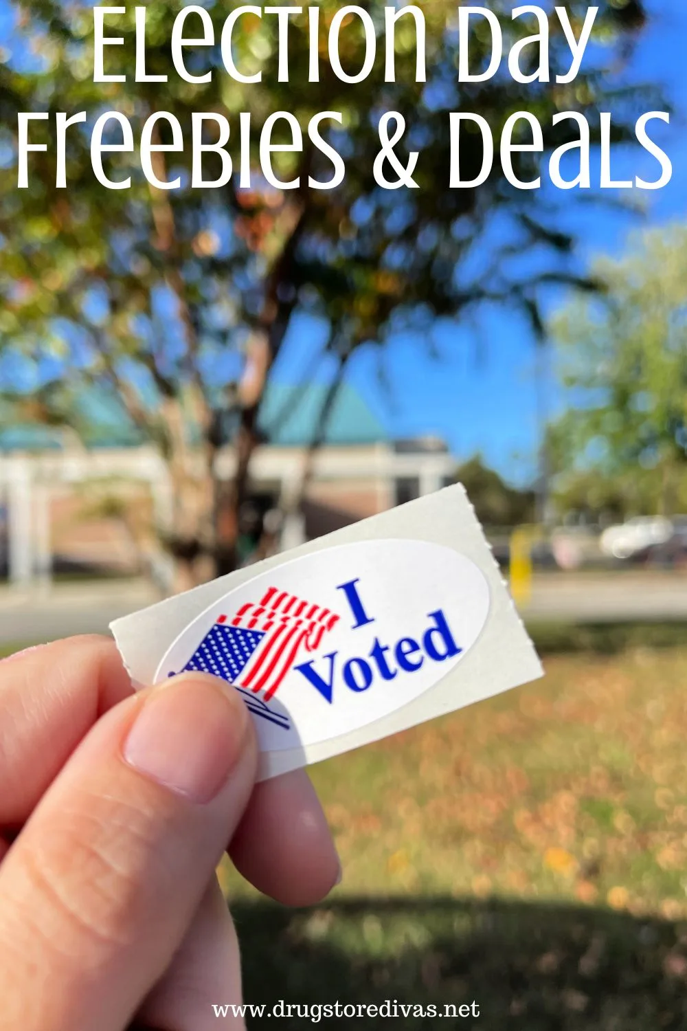 A hand holding an I Voted sticker with trees in the background and the words 