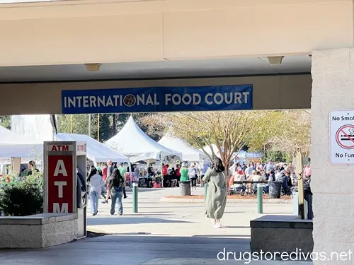The entrance to an outdoor food hall with a banner saying "International Food Court" above it.