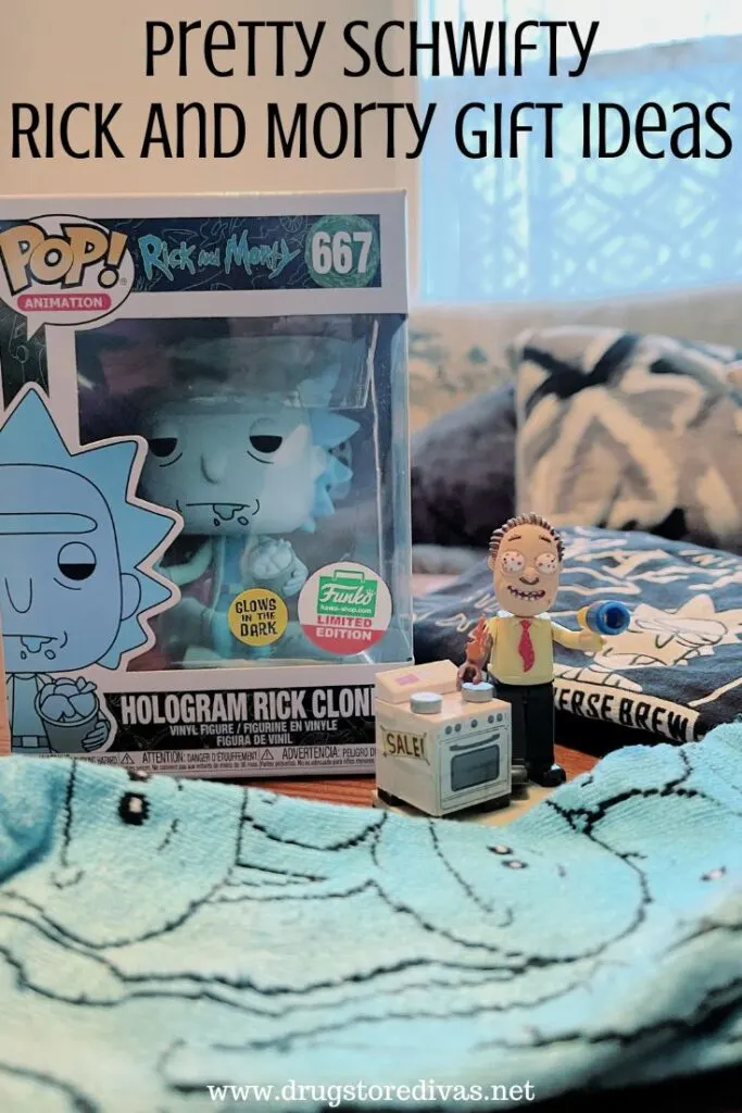 A Funko Pop, black shirt, blue socks, and a small action figure on a table with the words "20+ Pretty Scwifty Rick And Morty Gift Ideas" digitally written on top.