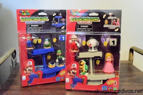 Two closed packages of the Super Mario Bros balancing game in a house.