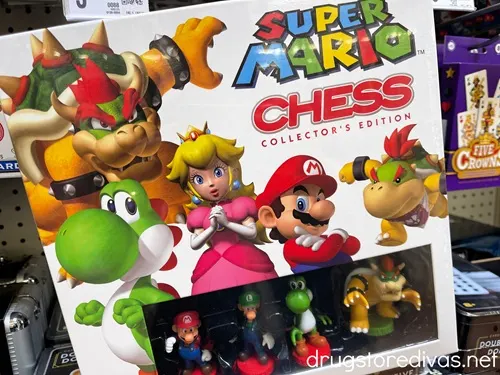A Super Mario Chess game in a box on a shelf in a store.