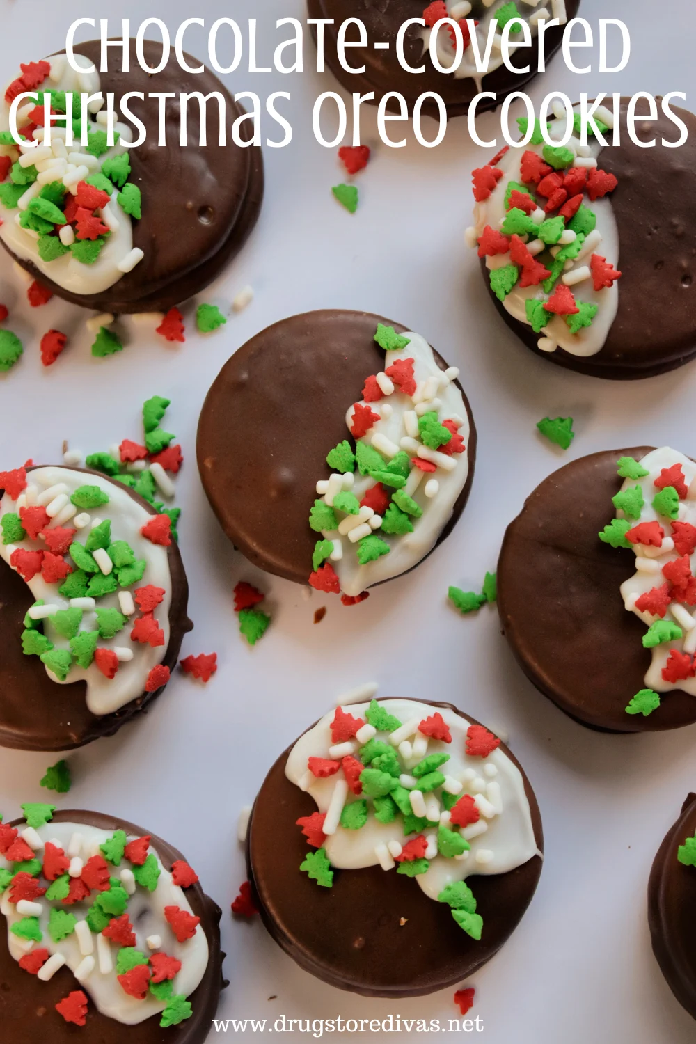 Black and white chocolate covered cookies, with red and green sprinkles on the white side, on a white tray with the words 
