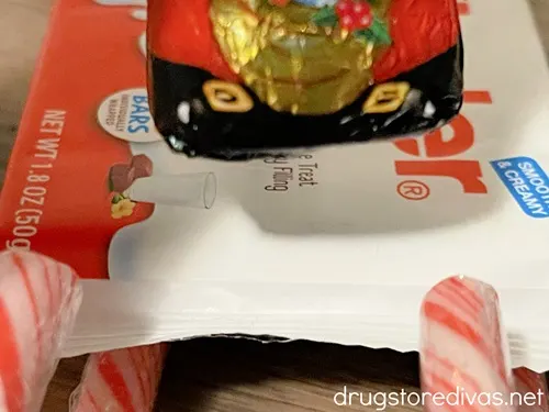 The bottom of a chocolate Santa above a Kinder bar.