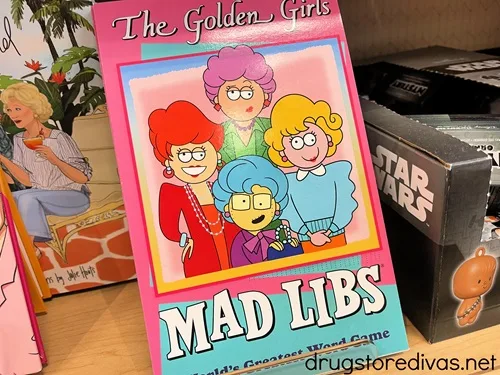 A Golden Girls Mad Libs book in a store.