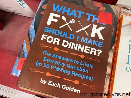 What the F*@# Should I Make for Dinner? Book on a table in a store.