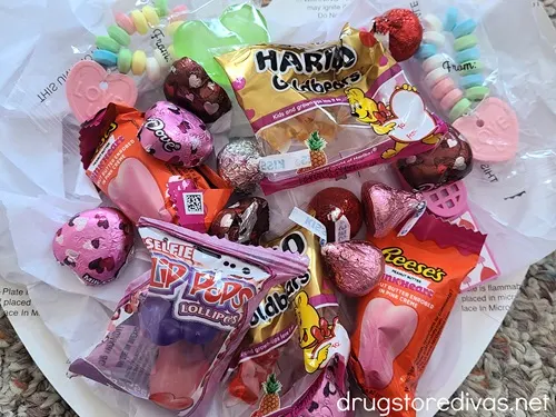 Various Valentine's Day-themed candies on top of a plate.