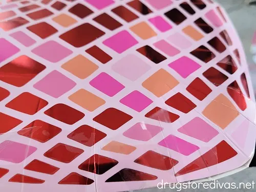 A pink and red disco ball-looking plate.