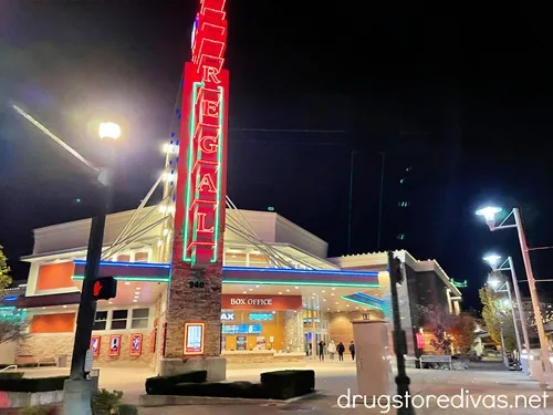 The outside of a Regal Cinema movie theater at nighttime.