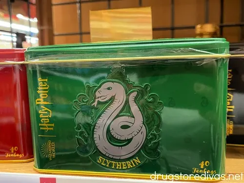 A green box of tea with a snake on it that's branded with a Harry Potter logo.