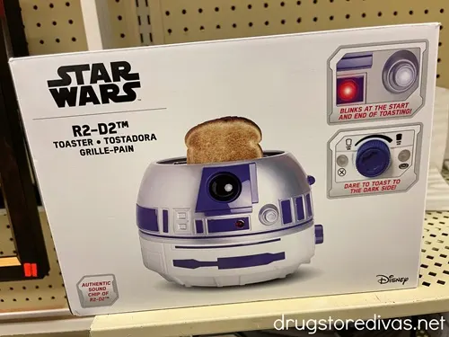 A Star Wars R2D2 Toaster on a shelf.