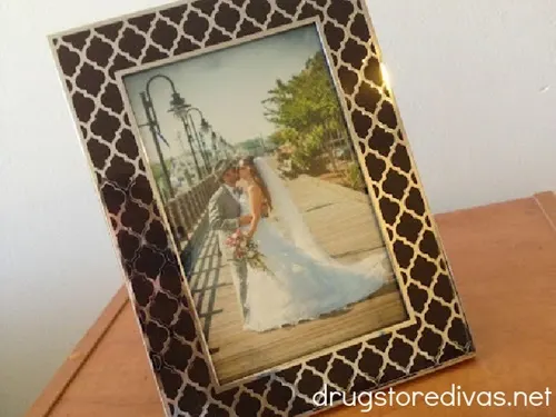 A couple's wedding photo in a picture frame.
