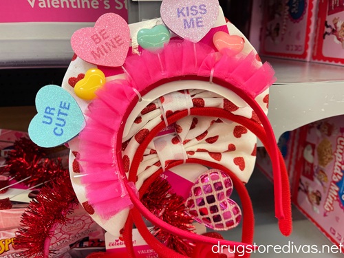 A stack of Valentine's Day headbands for sale in a store.
