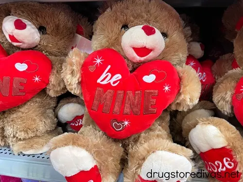 A teddy bear stuffed animal holing a heart.
