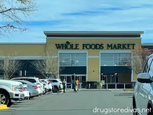 The outside of a Whole Foods grocery store and parking lot.
