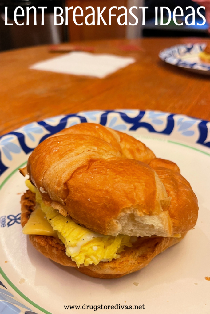 An egg sandwich on a kaiser roll on a paper plate on a table with the words "Lent Breakfast Ideas" digitally written on top.