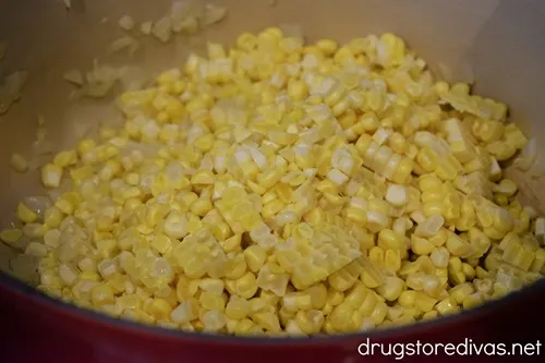 Corn kernels in a red Dutch oven.