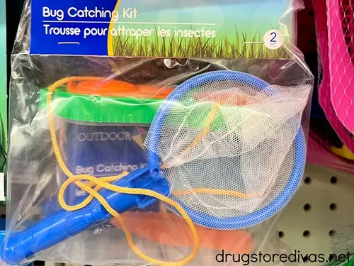 A bug catching net in a bag on a peg at a store.