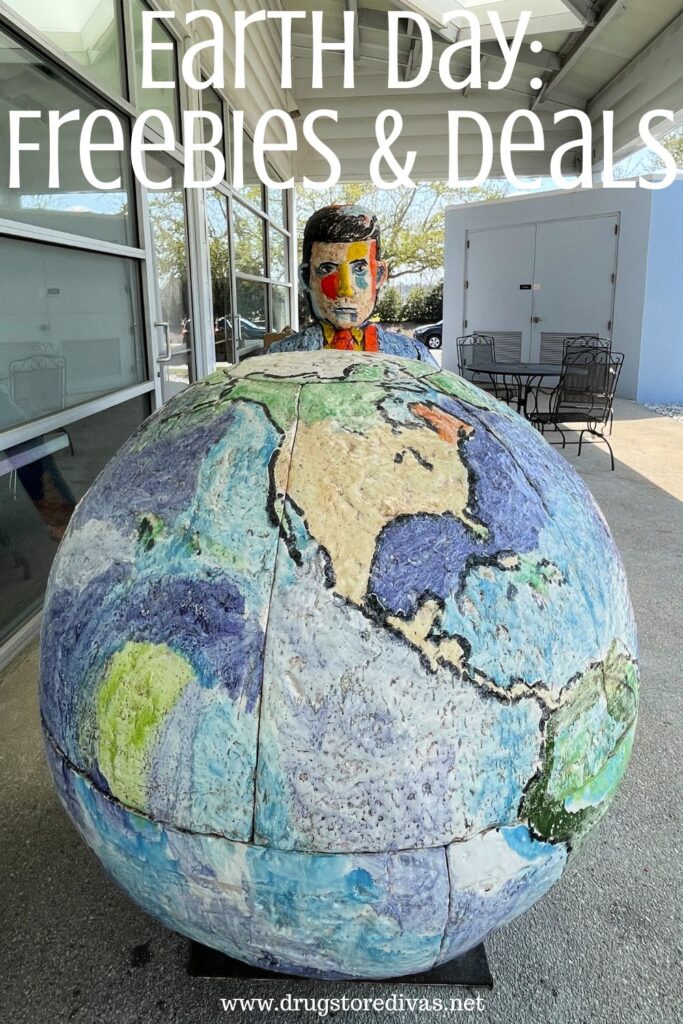 A sculpture of a man behind a globe with the words "Earth Day" Freebies & Deals" digitally written on top.