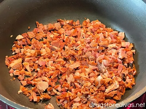 Cooked diced ham in a pan.