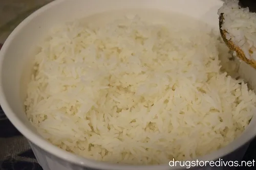Cooked rice in a round, white bowl.