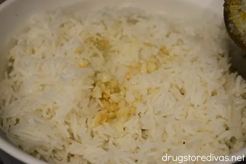 Garlic and olive oil on top of cooked rice.