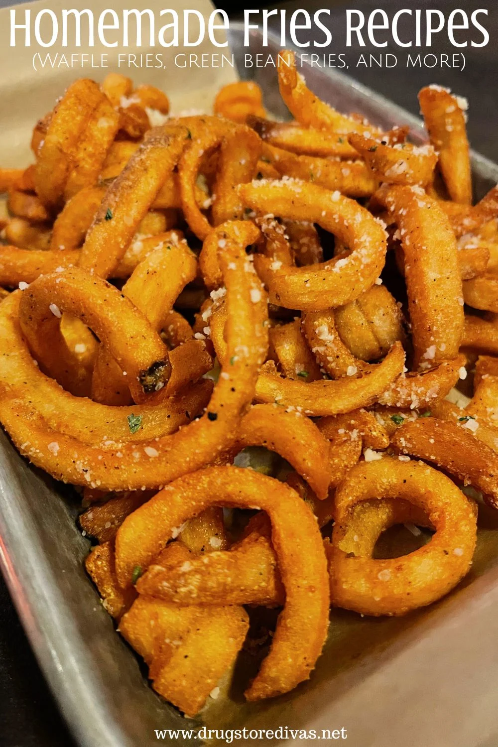 Curly fries on a tray with the words 