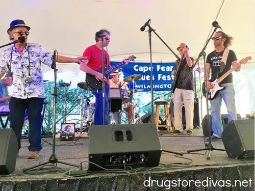 Four men in a band on stage during the Cape Fear Blues Festival at the Rusty Nail in Wilmington, NC.