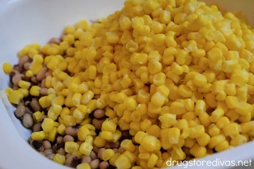 Black-eyed peas and corn in a white bowl.