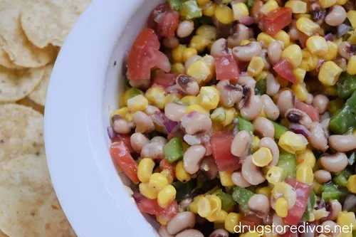 Carolina Caviar in a white bowl with tortilla chips to the side.