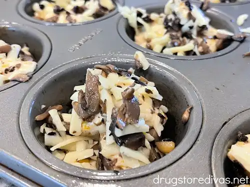 Unbaked mushroom and mozzarella pull apart muffins in a muffin pan.