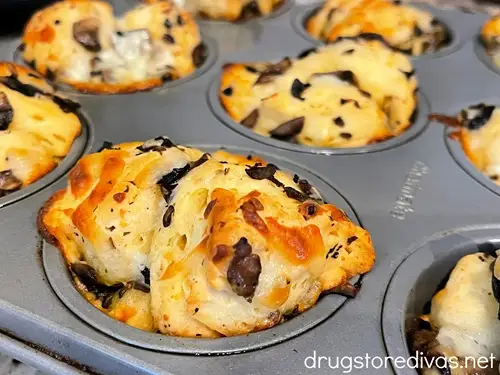 Baked mushroom and mozzarella pull apart muffins in a muffin pan.