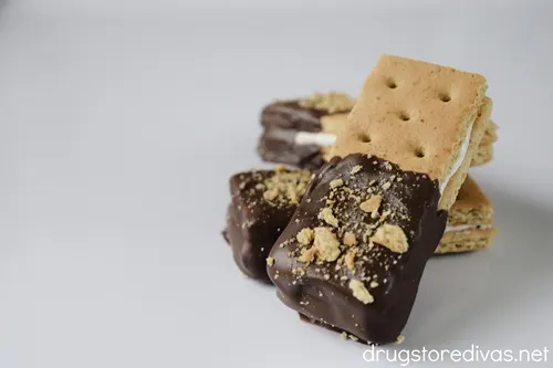 Three No Bake S'mores Cookies With Marshmallow Fluff on a white plate.
