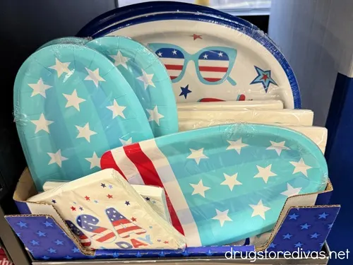 Patriotic plates and napkins for sale at a store.