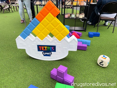 A giant Tetris Tumble game set up with pieces and a die around.