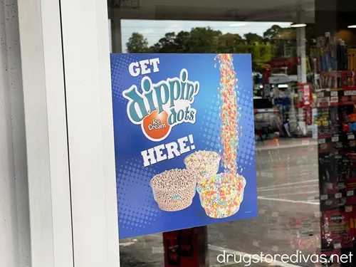 A sign advertising that Dippin' Dots are being sold at the location.