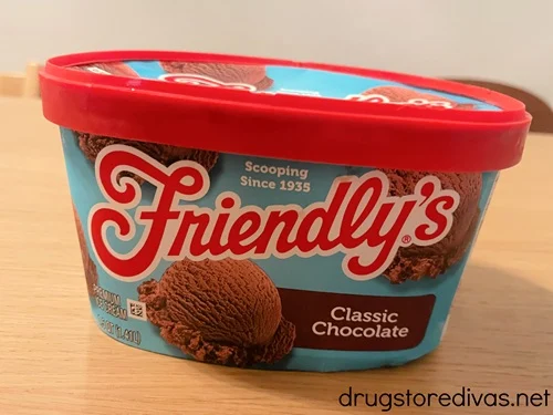 A container of Friendly's classic chocolate ice cream on a shelf.