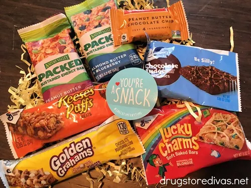 A sample box from Gratsy with seven different snack bars in it.