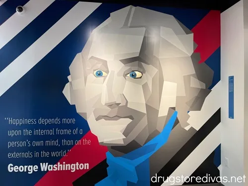 George Washington's face on a wall with a quote in the Museum of Illusions in Washington, DC.