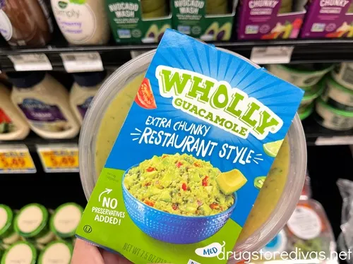 A container of Wholly Guacamole in a grocery store.