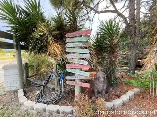 A Beach Location Mileage Wooden Sign located at Dunrovin Country Store in Vass, NC.
