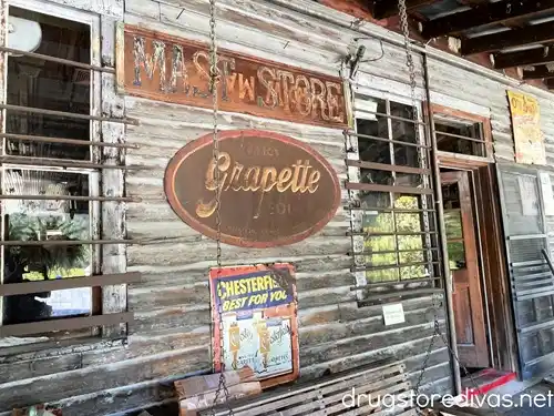 A wooden porch with a swing and vintage signs at Mast General Store in North Carolina.
