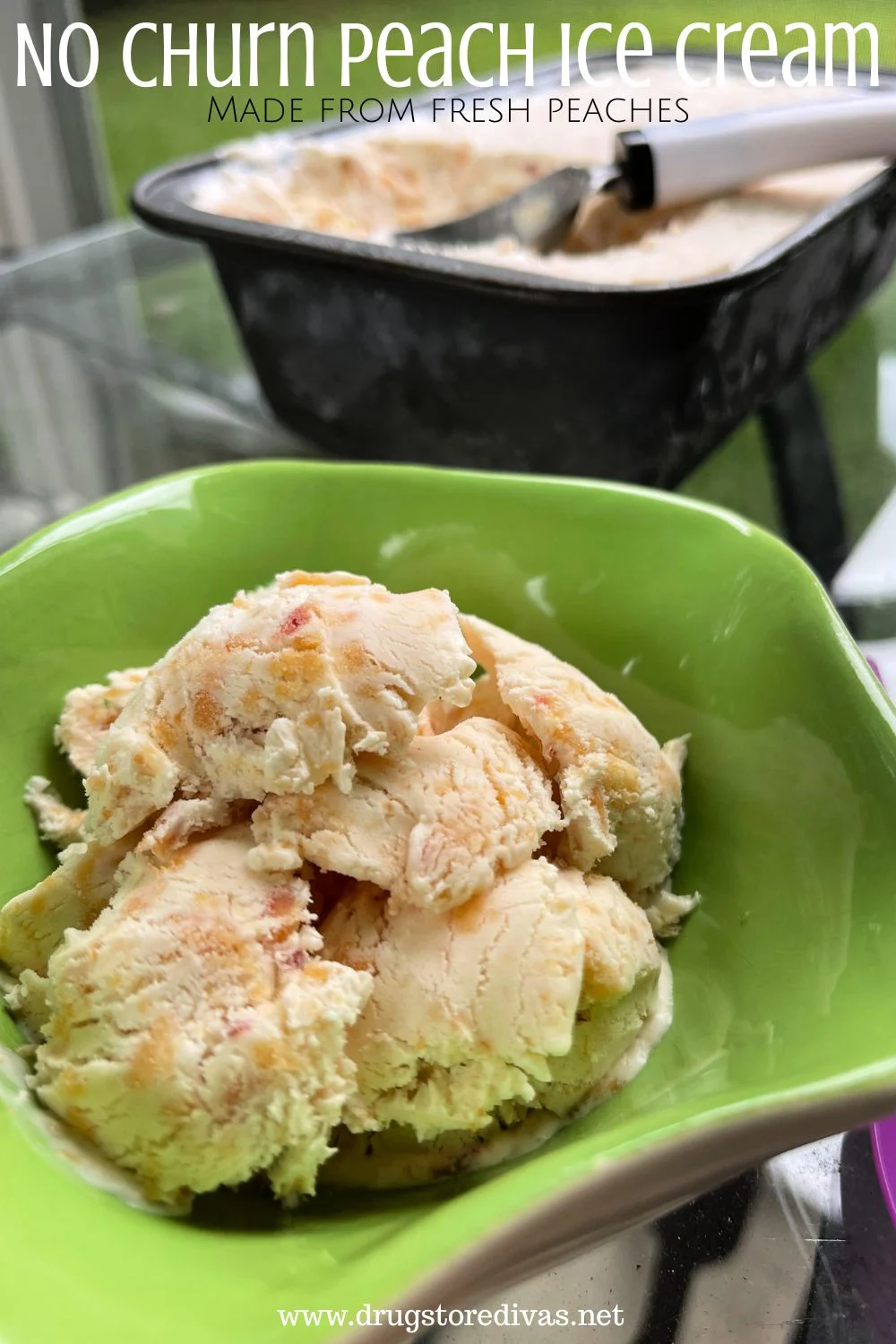 Peach ice cream in a green bowl with a metal pan of ice cream behind it and the words 