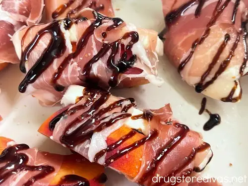 Prosciutto wrapped peach and mozzarella slices.
