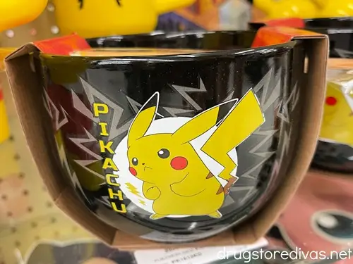 A black ramen bowl with a yellow Pikachu on it.