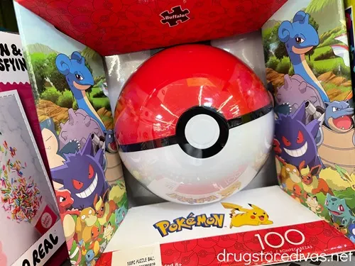 A Pokemon Puzzle Ball in a box on a shelf.