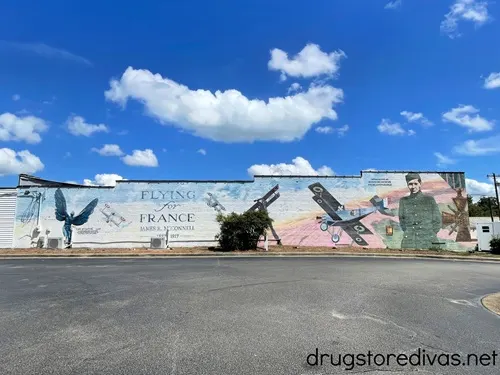 A mural with a man and an airplane called Flying for France.