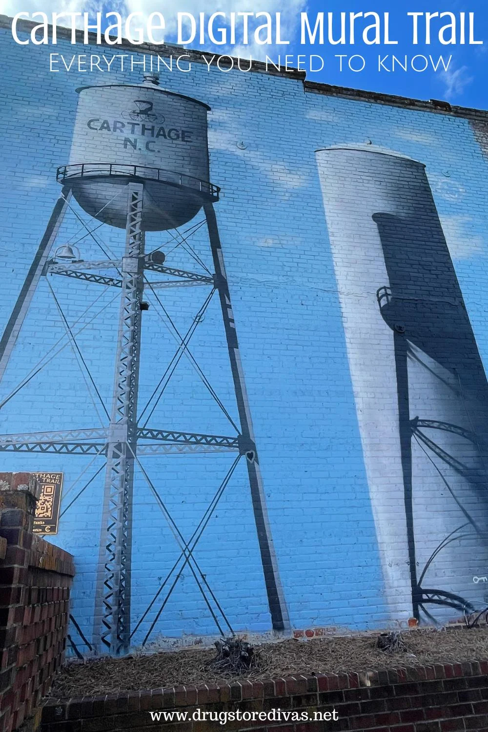 A mural of two water towers with the words 